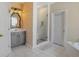 Elegant bathroom featuring a walk-in shower, vanity sink, and a soothing soaking tub at 770 Huiet Dr, Mcdonough, GA 30252
