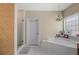 Serene bathroom with a soaking tub and separate walk-in shower at 770 Huiet Dr, Mcdonough, GA 30252