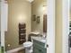 Charming half-bathroom features granite countertops and lovely decorations at 770 Huiet Dr, Mcdonough, GA 30252