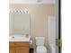 Standard bathroom with an extended vanity, framed mirror, and tile flooring at 770 Huiet Dr, Mcdonough, GA 30252