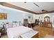 Bright bedroom features a large window, ensuite bathroom, and tiled floors at 770 Huiet Dr, Mcdonough, GA 30252