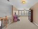 Large bonus room featuring neutral carpeting, big windows and view of the backyard at 770 Huiet Dr, Mcdonough, GA 30252