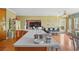 Modern kitchen boasts a large island and seamless transition to the living space at 770 Huiet Dr, Mcdonough, GA 30252