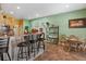 Kitchen features a long breakfast bar with seating and tile flooring at 770 Huiet Dr, Mcdonough, GA 30252