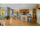 Open-concept kitchen boasts a large island, wood floors, and ample counter space at 770 Huiet Dr, Mcdonough, GA 30252