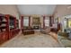 Cozy living room with fireplace, plush seating, and large area rug at 770 Huiet Dr, Mcdonough, GA 30252
