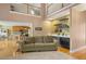 Spacious living room featuring hardwood floors, a fireplace, and wet bar with open access to the kitchen at 770 Huiet Dr, Mcdonough, GA 30252