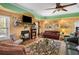 Inviting living room with a fireplace, flat-screen television, and warm, comfortable furniture at 770 Huiet Dr, Mcdonough, GA 30252
