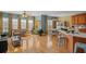 Spacious living room with hardwood floors connected to an open kitchen at 770 Huiet Dr, Mcdonough, GA 30252