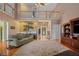 Open living room featuring hardwood floors, a wet bar, and lots of light at 770 Huiet Dr, Mcdonough, GA 30252