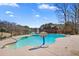 Enjoy a refreshing outdoor pool with lake views in this beautiful backyard at 770 Huiet Dr, Mcdonough, GA 30252