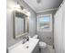 Bathroom featuring a large mirror, a vanity with lighting, and a shower with a curtain at 2717 Hedgewood Nw Dr, Atlanta, GA 30311