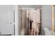 Tiled walk-in shower with modern fixtures and neutral shower curtain at 2717 Hedgewood Nw Dr, Atlanta, GA 30311
