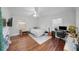 Well-lit bedroom featuring hardwood floors, a ceiling fan, and a workspace with a desk at 2717 Hedgewood Nw Dr, Atlanta, GA 30311