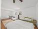 Spacious bedroom with hardwood floors, a large bed, and a comfortable seating area at 2717 Hedgewood Nw Dr, Atlanta, GA 30311