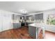 Bright kitchen with granite countertops, stainless steel appliances, gray cabinets, and a convenient breakfast bar at 2717 Hedgewood Nw Dr, Atlanta, GA 30311