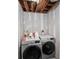 Laundry area featuring a modern front-load washer and dryer at 2717 Hedgewood Nw Dr, Atlanta, GA 30311