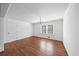 Bright living room featuring hardwood floors, a chandelier, and a window letting in natural light at 2717 Hedgewood Nw Dr, Atlanta, GA 30311