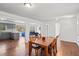 Spacious living area features hardwood floors, open layout with dining area, kitchen access and contemporary gray cabinets at 2717 Hedgewood Nw Dr, Atlanta, GA 30311