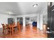 Open-concept living space seamlessly connecting the dining room, kitchen with bar seating, and a cozy living area at 2717 Hedgewood Nw Dr, Atlanta, GA 30311