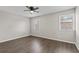 Bedroom offers natural light, ceiling fan and wood-look floors at 2828 Webb Bridge Rd, Alpharetta, GA 30009