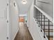 Inviting hallway with hardwood floors leading to the living area at 2828 Webb Bridge Rd, Alpharetta, GA 30009