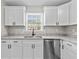 Kitchen features bright white cabinets and granite countertops at 2828 Webb Bridge Rd, Alpharetta, GA 30009