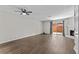 Spacious living room with hardwood floors, fan, fireplace, and sliding glass doors at 2828 Webb Bridge Rd, Alpharetta, GA 30009