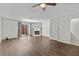 Bright living room featuring hardwood floors, a fireplace, and lots of natural light at 2828 Webb Bridge Rd, Alpharetta, GA 30009