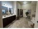 Gorgeous primary bath with double vanity, tile flooring, soaking tub, and lots of light at 949 Nevis Way, Mcdonough, GA 30253