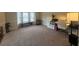 Open Bonus Room or Office with natural light and neutral carpeting at 949 Nevis Way, Mcdonough, GA 30253