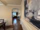 Hallway leading to an eat-in kitchen with a breakfast bar and granite countertops at 949 Nevis Way, Mcdonough, GA 30253