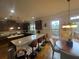 Bright kitchen features granite countertops, pendant lighting, stainless steel appliances, and breakfast bar seating at 949 Nevis Way, Mcdonough, GA 30253