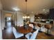 Cozy breakfast nook situated within a spacious kitchen with hardwood floors at 949 Nevis Way, Mcdonough, GA 30253