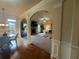 Open-concept living room with stone fireplace and seamless flow to the dining area at 949 Nevis Way, Mcdonough, GA 30253