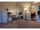 Bright home office space featuring neutral tones, a desk, a filing cabinet, and a modern lamp at 949 Nevis Way, Mcdonough, GA 30253