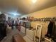 Expansive walk-in closet with tons of built in shelving and storage for your wardrobe at 949 Nevis Way, Mcdonough, GA 30253