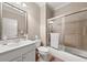 Well-maintained bathroom featuring shower, tub, and modern fixtures at 5002 Davenport Pl, Roswell, GA 30075