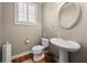 Powder room with pedestal sink, and plantation shutters at 5002 Davenport Pl, Roswell, GA 30075