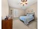 Bedroom with neutral carpeting, and a ceiling fan at 5002 Davenport Pl, Roswell, GA 30075