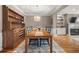 Inviting dining room with stylish chandelier and views into other living spaces at 5002 Davenport Pl, Roswell, GA 30075