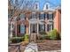Charming brick townhouse with black shutters and a well-maintained front yard at 5002 Davenport Pl, Roswell, GA 30075