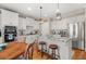 Well-lit kitchen with white cabinetry, a center island, and stainless steel appliances at 5002 Davenport Pl, Roswell, GA 30075