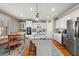Bright kitchen with stainless steel appliances, granite countertops, and a kitchen island at 5002 Davenport Pl, Roswell, GA 30075