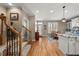 Open-concept living space showcasing hardwood floors and seamless transitions between rooms at 5002 Davenport Pl, Roswell, GA 30075