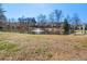 Scenic view of pond with fountain and lush surroundings at 5002 Davenport Pl, Roswell, GA 30075