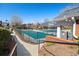 Community pool area surrounded by decorative fencing and walkway at 5002 Davenport Pl, Roswell, GA 30075