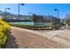 Community tennis courts surrounded by manicured bushes at 5002 Davenport Pl, Roswell, GA 30075