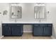 Bathroom vanity with double sinks, modern mirrors and ample storage space at 3119 Devauden Ct, Duluth, GA 30096