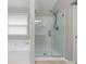 Bathroom showcasing separate soaking tub and clear glass enclosed shower at 3119 Devauden Ct, Duluth, GA 30096